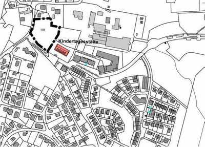 Skizze vom EcoQuartier. Die Fläche neben dem rot gekennzichneten Kindergarten ist dick-schwarz umrandet.