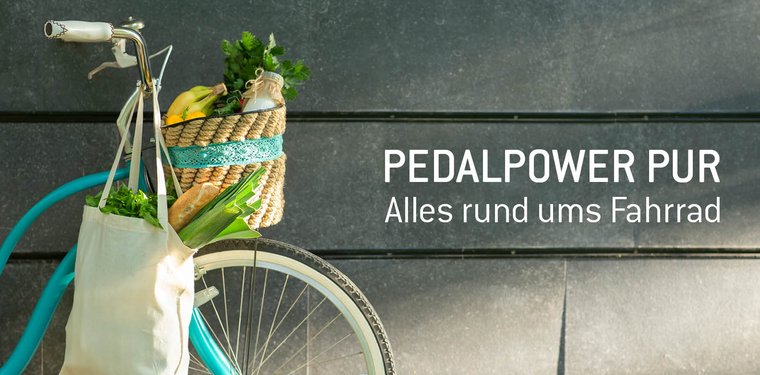 Fahrrad mit Einkäufen und Text: Pedalpower pur - Alles rund ums Fahrrad