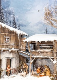 Kastenschneekrippe mit Figuren und winterlichem Hintergrund.